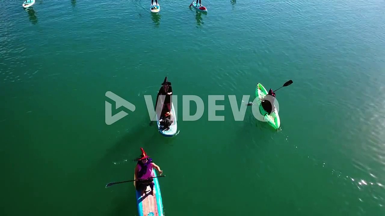 Aerial Witches Paddle On Surfboards And Paddleboards To Celebrate Halloween In Ventura Harbor, California