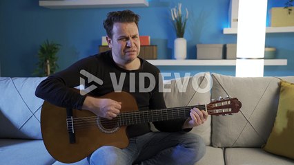 Depressed man at home, portrait of worried man with personal problems feeling stressed and helpless