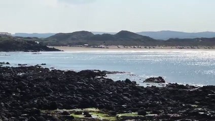 Blue skies, golden beach, tranquil waters and a stunning coastline...Spain or Portstewart?