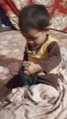 Little baby wearing baba's cap for prayer 🙏