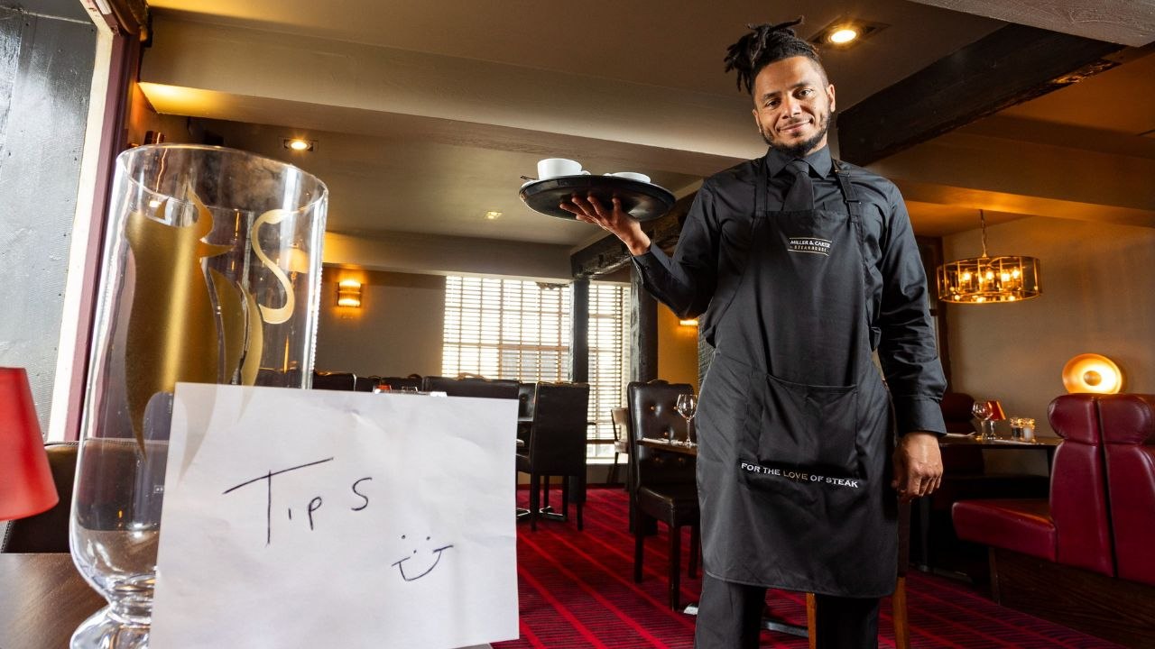 Restaurant waiter saved £8k in tips for three years to help GCSE students