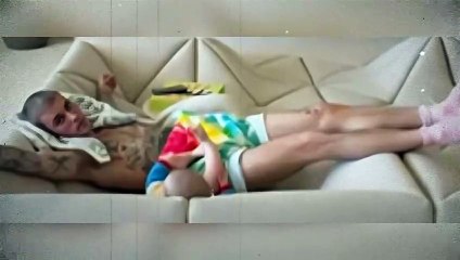 Justin Bieber Lounges on Sofa With Baby Jack Blues Bieber in Sweet