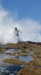 Man Caught by Sudden Sea Wave