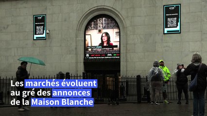 Droits de douane: des Américains "inquiets" réagissent devant la Bourse de New York
