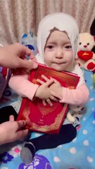 Cute baby not giving Quran