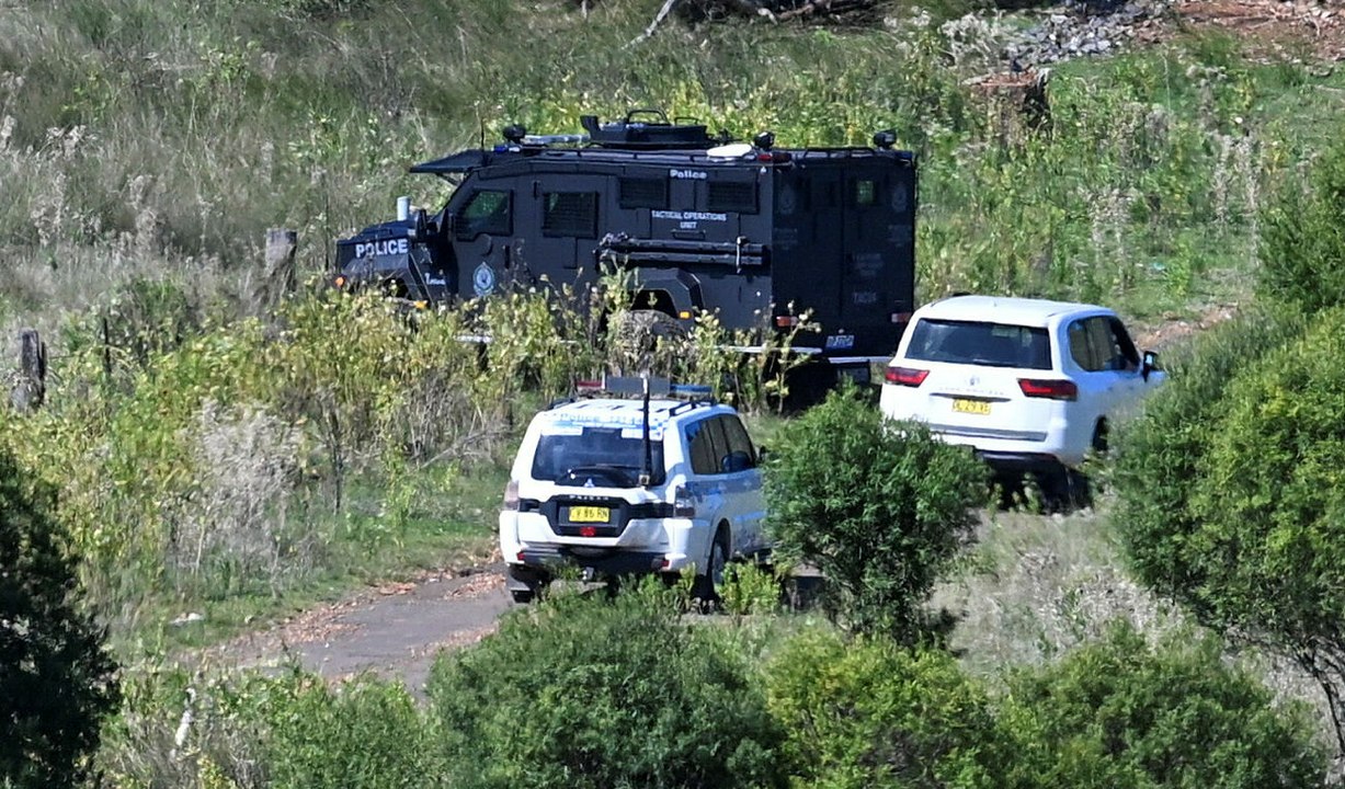 Tactical police and bearcat vehicle swarm property on edge of Tamworth.