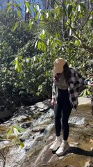 Woman Loses Balance on Slippery Rock and Lands on Her Shoulder