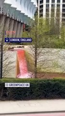 Activists in London turn U.S. embassy red