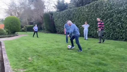 Player Slips Into Pond During Backyard Football Game