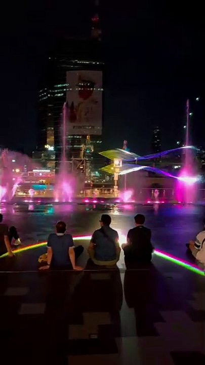 "Dancing under the rainbow lights at IconSiam’s magical fountain! 🌈✨