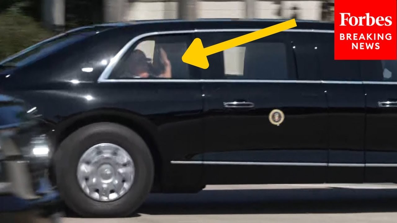 Trump Waves To Bystanders As He Arrives At Trump International Golf Club In West Palm Beach