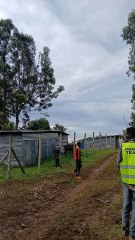 man hangs from helicopter