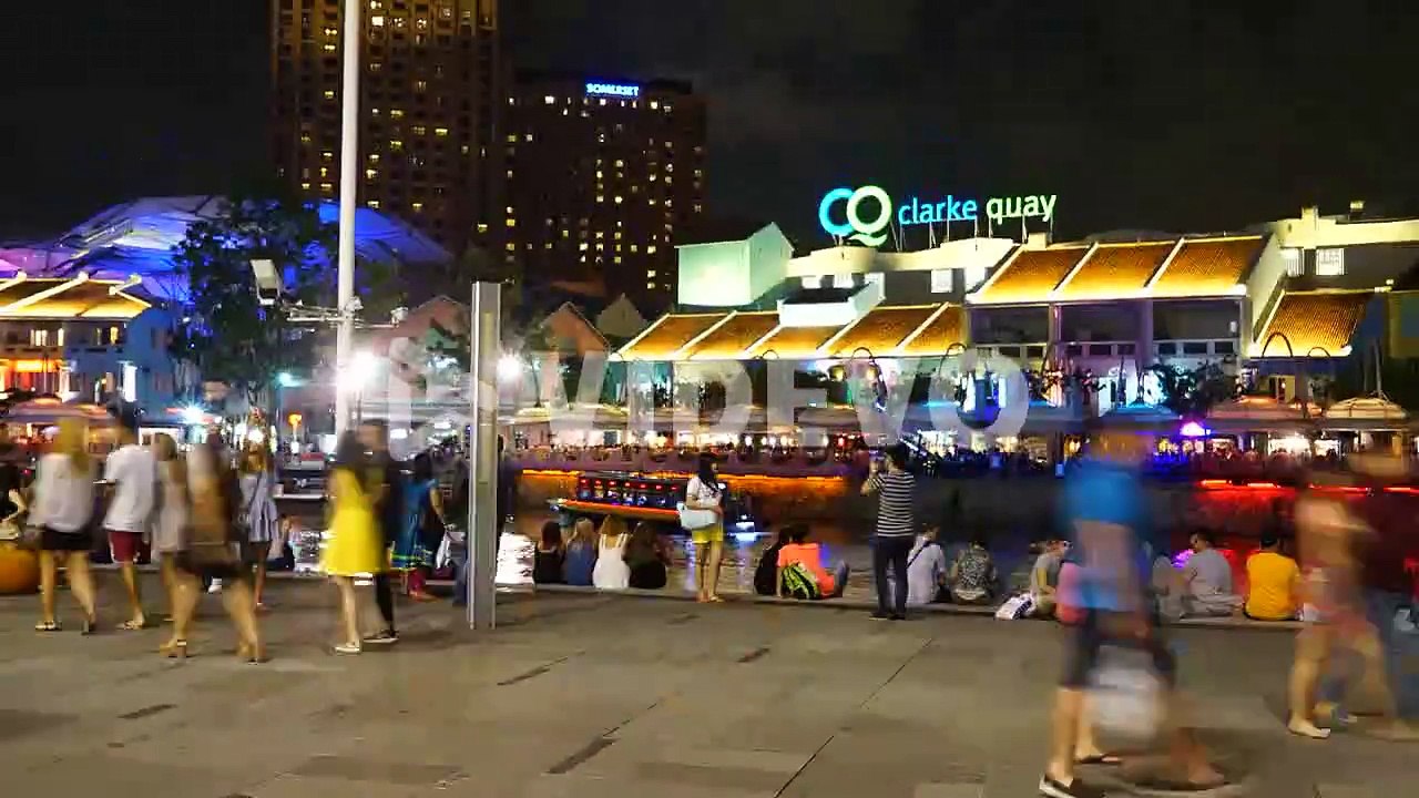Singapore - Circa Time-Lapse boat traffic and crowds move in and out of the Clarke Quay, Singapore