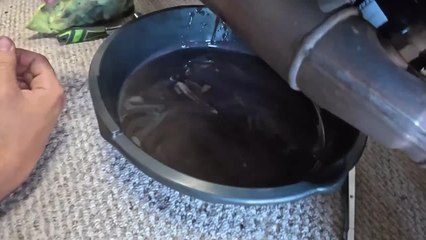 Man's Phone Slips From His Hand and Falls Into Vehicle Oil