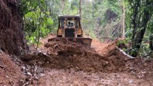 D6R XL Bulldozer Mountain Road Cleans Up Roads When It Rains