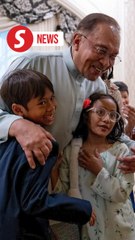 Anwar brings grandkids to office after they complain he's seldom home