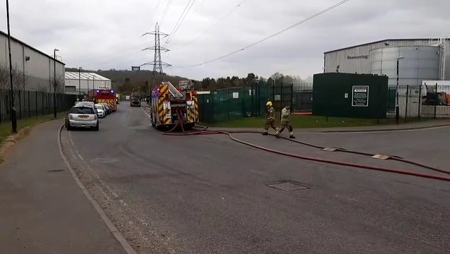 Watch as dozens of firefighters continue to tackle large morning blaze at waste recycling plant in Washington