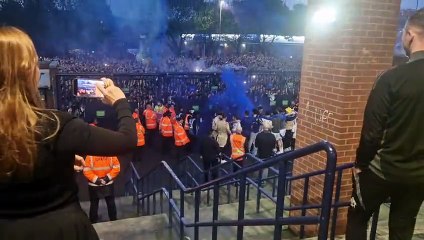 Leeds players celebrate promotion outside the East Stand