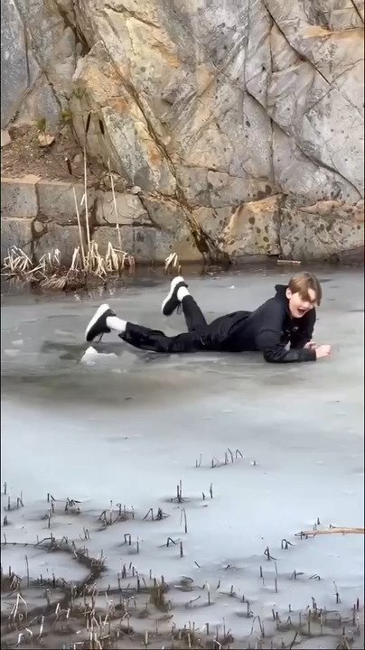 Teen Falls Into Frozen Water After Ice on Lake Breaks