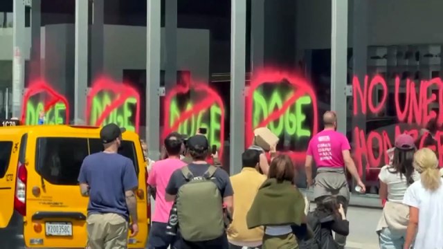 Extinction Rebellion stages Earth Day protest outside Tesla showroom
