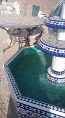 this fountain is made of broken ceramic tales.