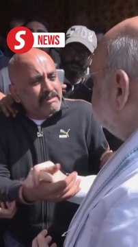 India's interior minister meets families of Kashmir attack victims