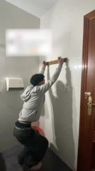 Man Leaps Up And Yanks Wall Hanger Off Before Crashing Down