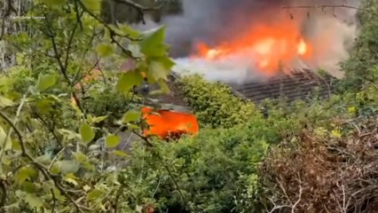 Dramatic moment derelict builder’s yard goes up in flames