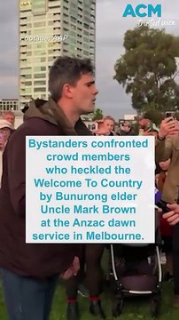 Bystanders confront crowd members who booed Welcome to Country