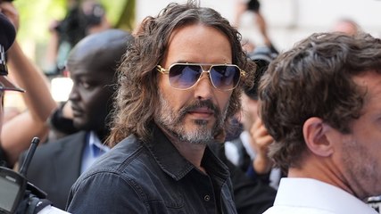 Russell Brand swarmed by photographers as he arrives at court to face rape and sexual assault charges