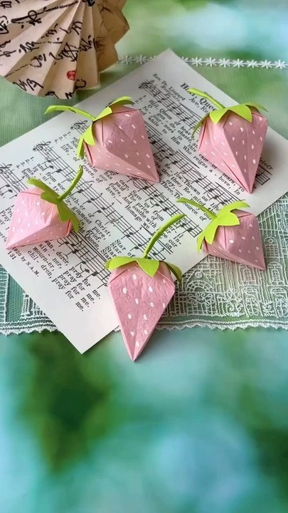 DIY Paper Strawberries Tutorial Learn how to make adorable pink paper strawberries in this fun and easy DIY tutorial! Perfect for party decor, gift wrapping, or cute room accents. Watch the video and get creative with your own sweet paper craft!