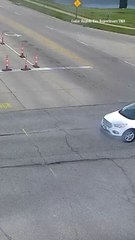 Smoking Car's Hood Bursts Into Flames at Intersection with Passenger Getting out Moments Before