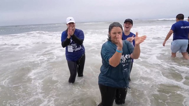 Sammy the Bull takes part in California's record-breaking mass water baptisms