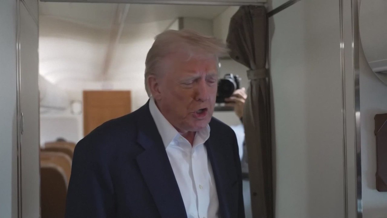 U.S. President Donald Trump speaks as he travels back to the White House