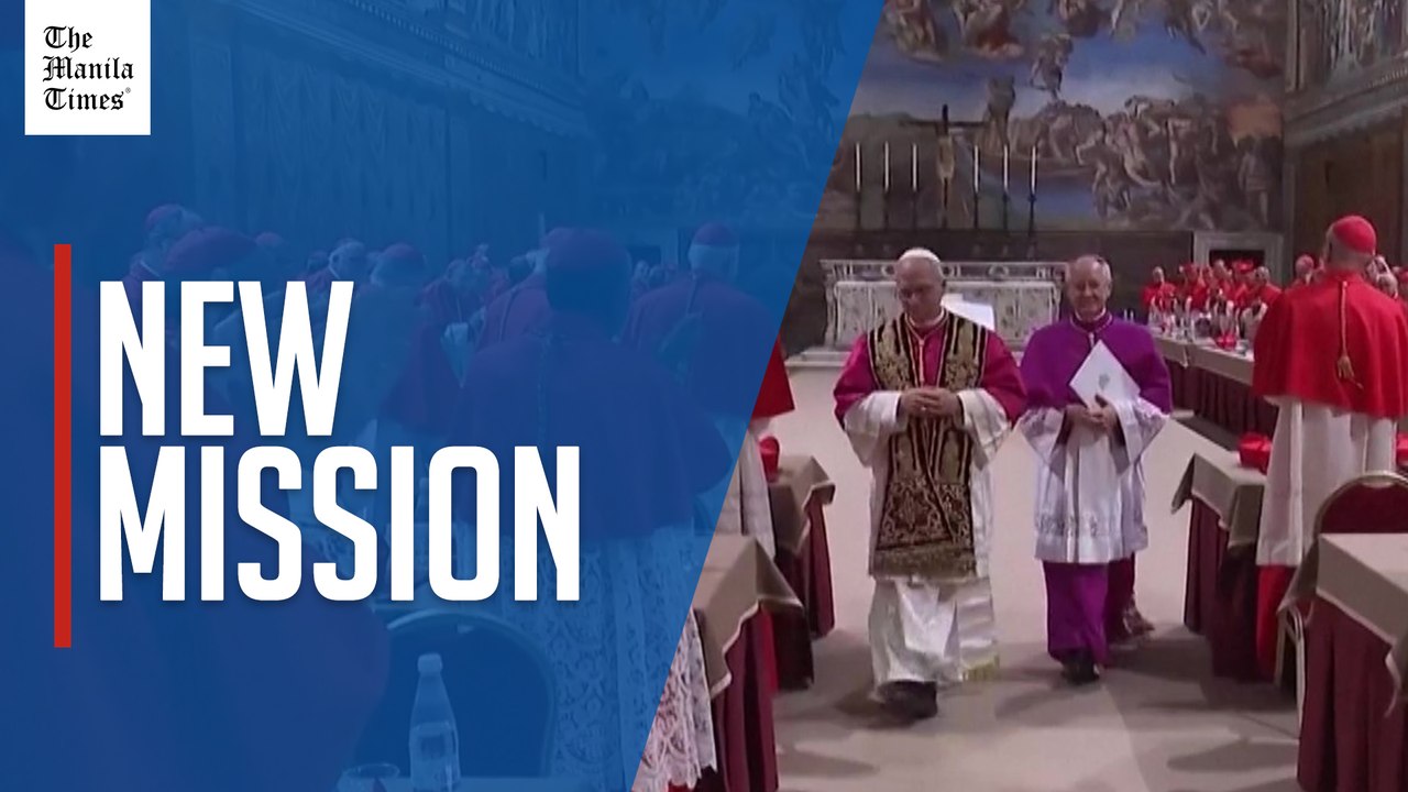 Pope Leo XIV prays after being elected