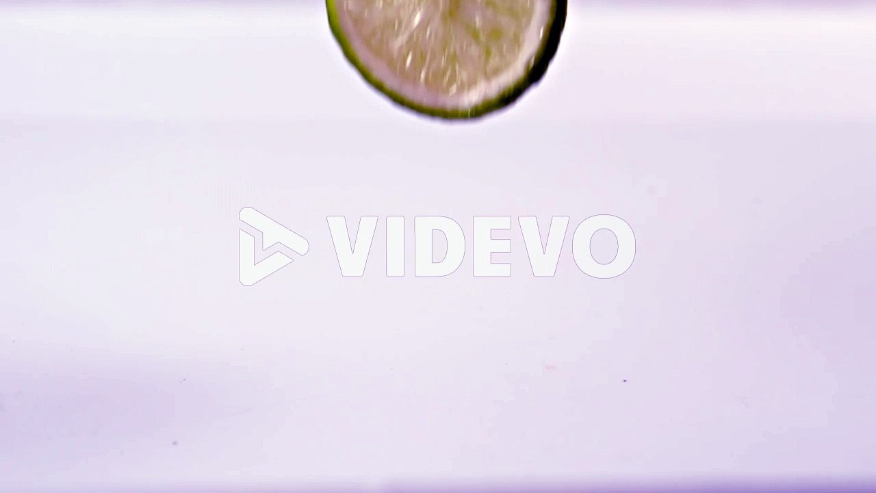 Lemon slices falling into water