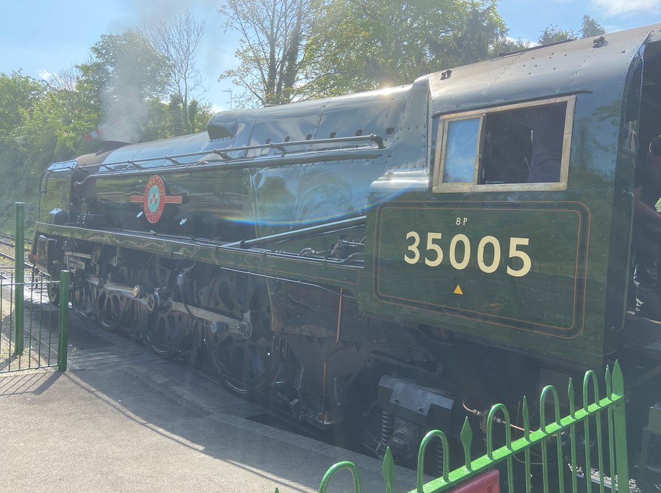 The Canadian Pacific steam locomotive arrives to couple up with the 11am VE Day 80 train from Alresford to Alton on the Watercress Line