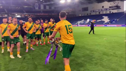 Horsham FC players and fans celebrate at the Amex Stadium after the Sussex Senior Cup is presented