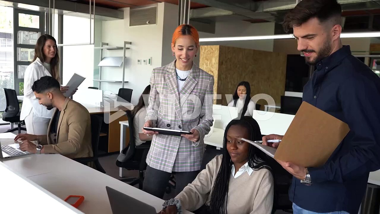 Company of multiethnic colleagues working together in office