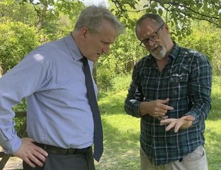 Damian Hinds learns about the poplar hawk-moth from Chris Wilkinson at Naturetrek in Chawton