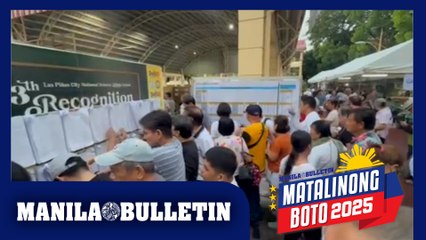 Priority voters line up early at Las Piñas City National Science High School