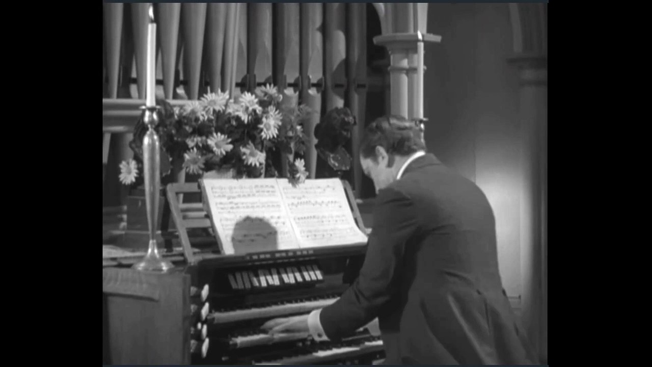 Dr. Jekyll at the organ playing late in the Fugue from Toccata and Fugue in D minor BWV 565
