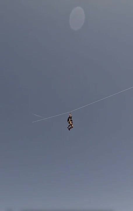 Base Jumper Slides Through Scary Zipline Before Jumping Off