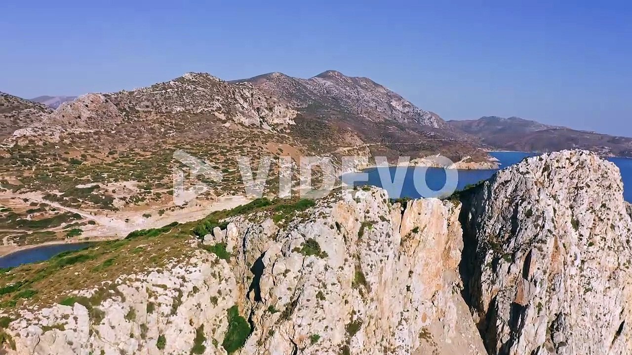 Aerial Footage Of Rocky Seashore Of Aegean Turkey And Marina With Sailing Yacht And Boats