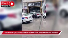 Yaralanan kız çocuğunun başında "ıslanmasın" diye şemsiyeyle bekledi