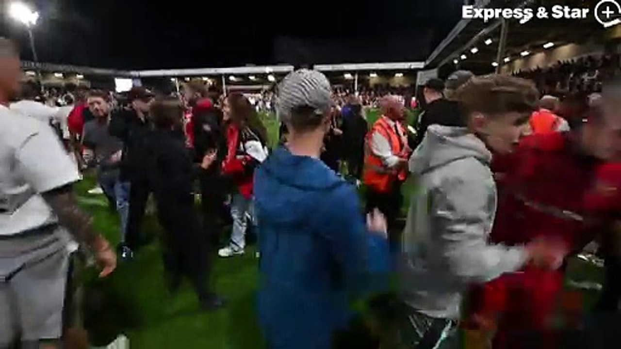 Saddlers fans celebrate on the pitch after beating Chesterfield to make it to the play-off final at Wembley!