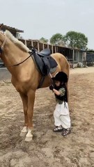 Kid riding horse.