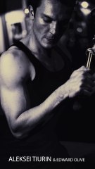 Handsome male model training muscles in gym