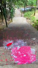 Rolling colorfull bottle on the stair