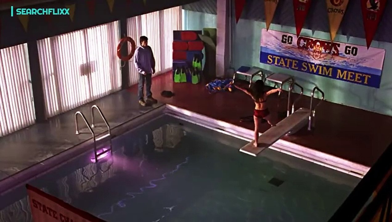 Lana flirts with Clark by the pool.